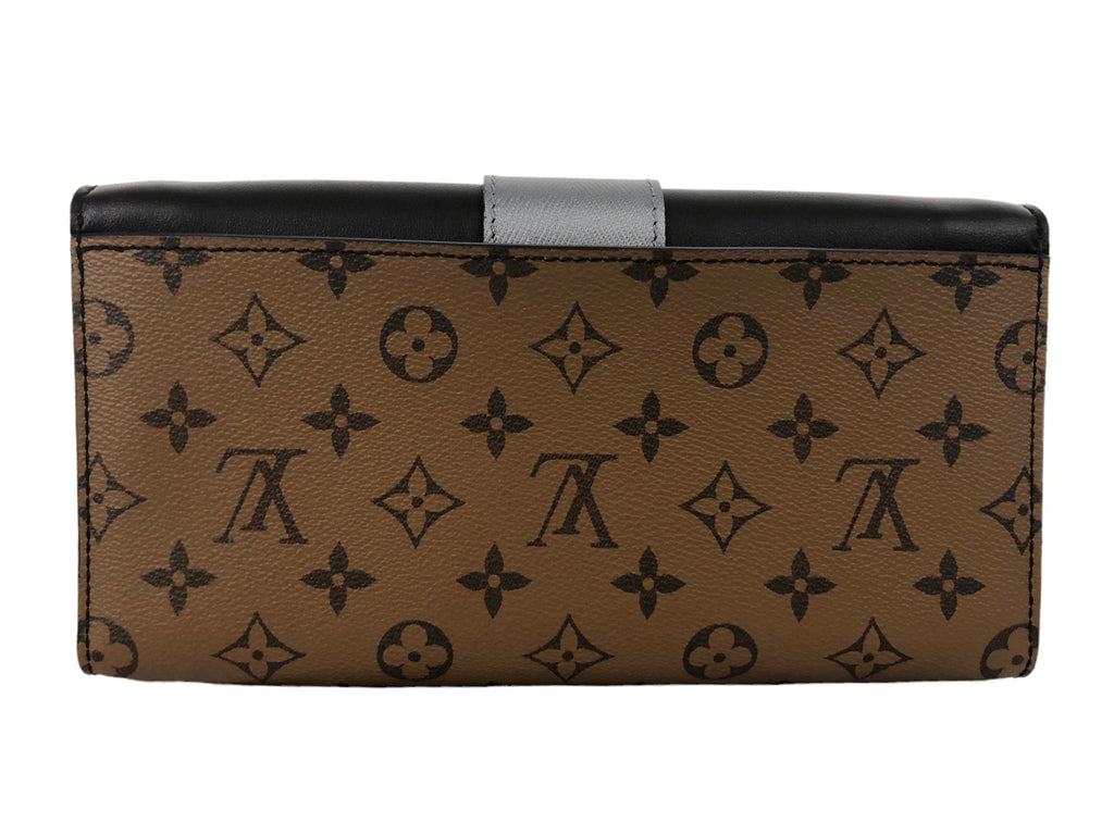 Calfskin Reverse Monogram Column Clutch – Baggio Consignment